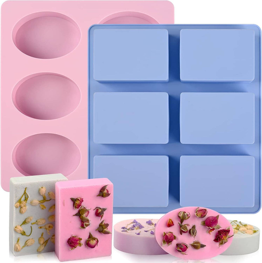 Two-piece silicone soap mold set with pink oval and blue rectangle cavities, filled samples shown