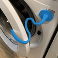 Blue magnetic washer door prop attached to the front-load washer door for ventilation.