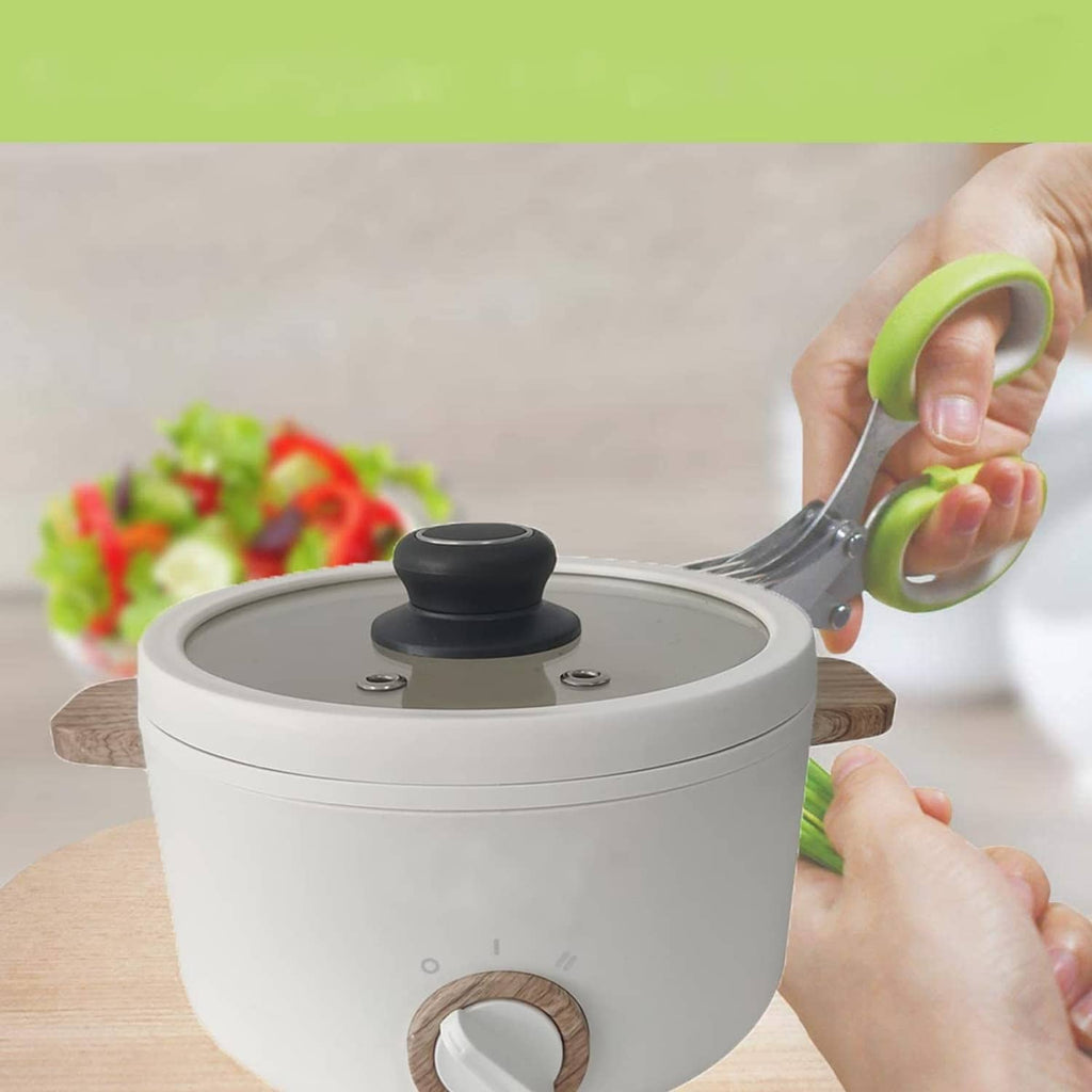 Black pot lid replacement knob on a stainless pot lid being lifted by hand
