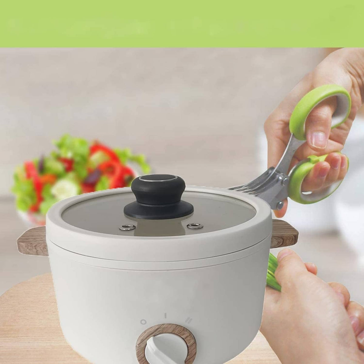 Black pot lid replacement knob on a stainless pot lid being lifted by hand