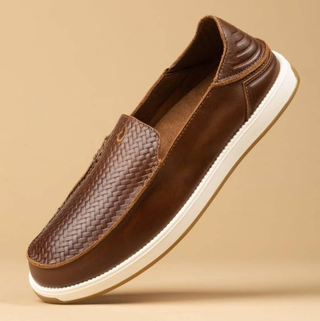 Brown leather slip-on sneaker close side view with woven panel and white midsole