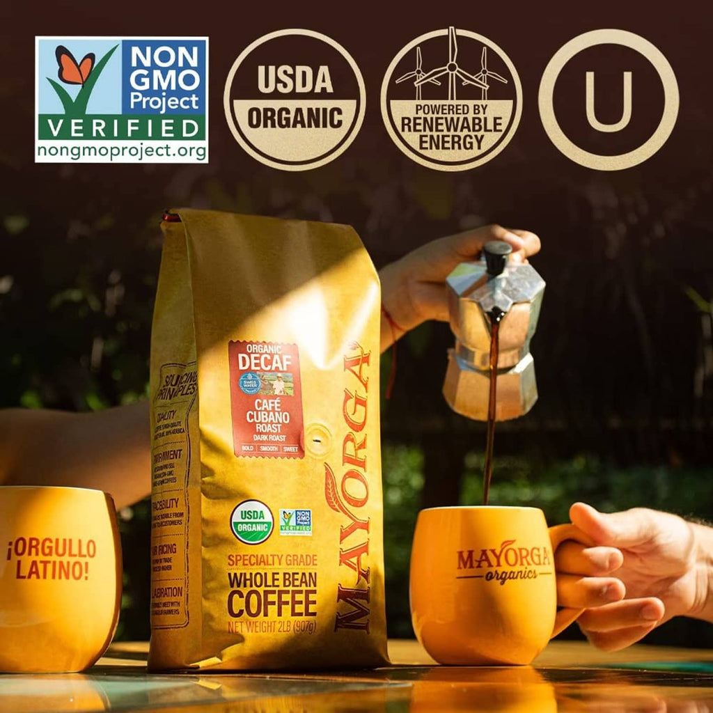 Organic decaf coffee bag with USDA organic and non-GMO badges beside two coffee mugs