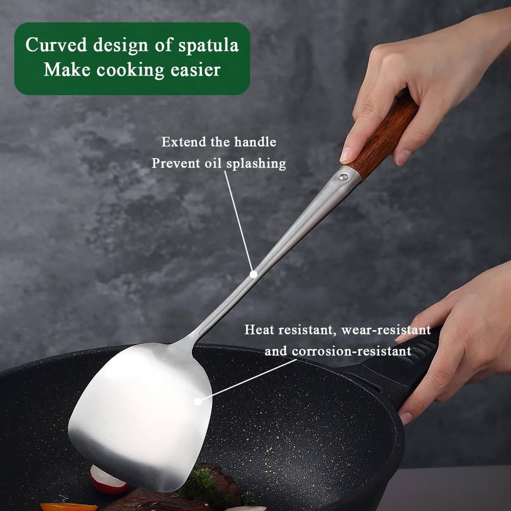 Stainless steel spatula head with curved shape and wooden handle held for cooking