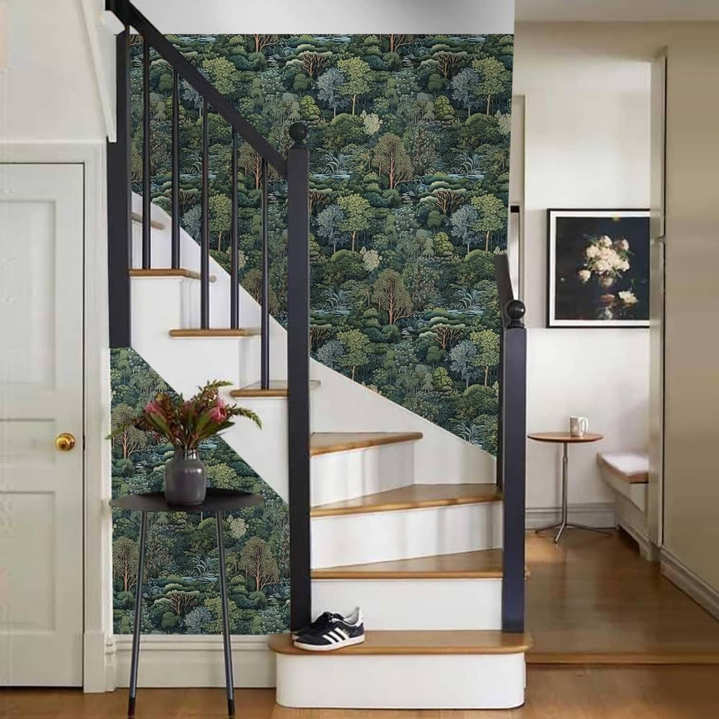 Green forest tree mural wallpaper on stairwell wall with railing and shoes near it