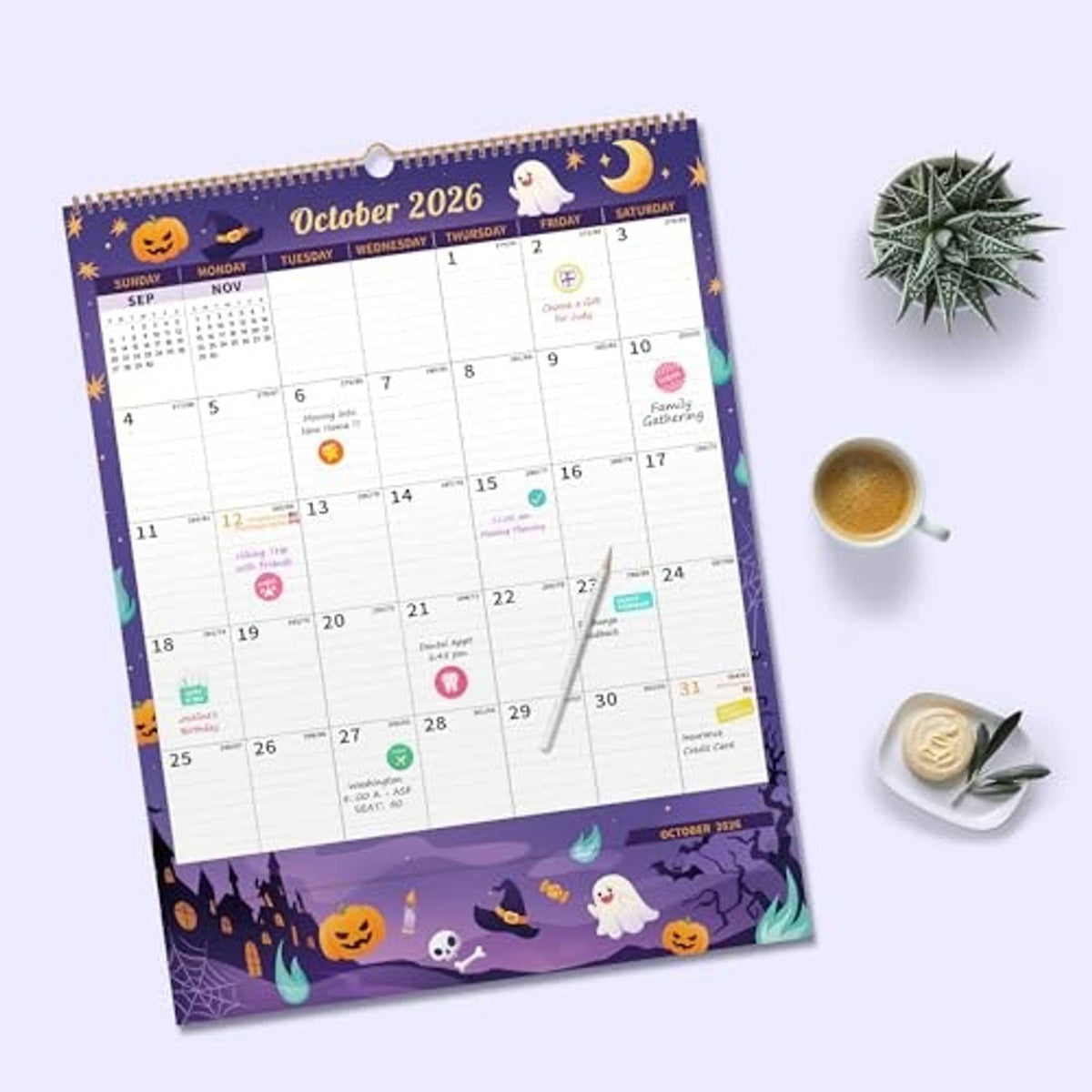 Purple Halloween-themed wall calendar with October 2026 layout and spiral binding