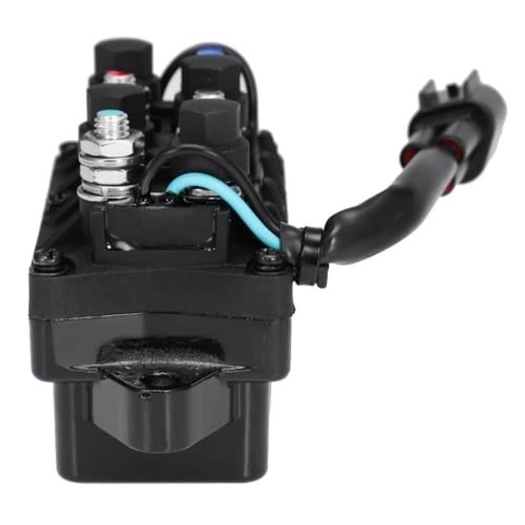 Black relay assembly showing electrical wiring and metal terminals on top