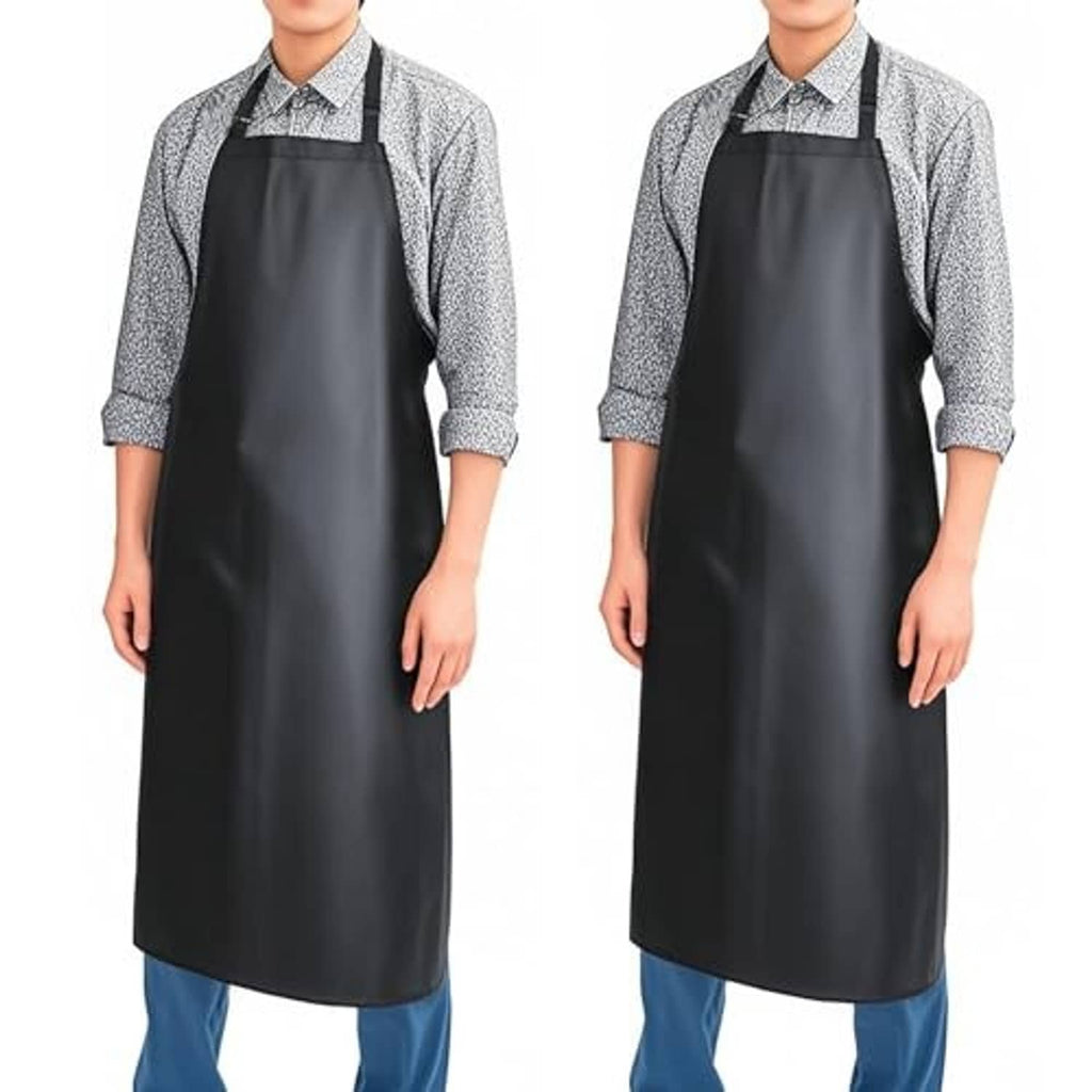 Black waterproof apron with wide bib and long skirt, worn over a patterned button-up shirt.