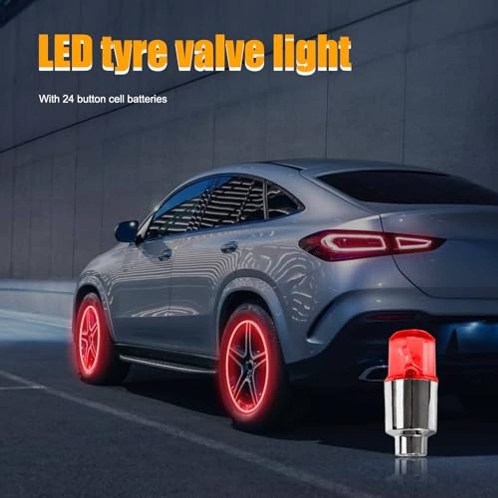 Red LED tire valve stem cap light by a car wheel with glowing red tire lights