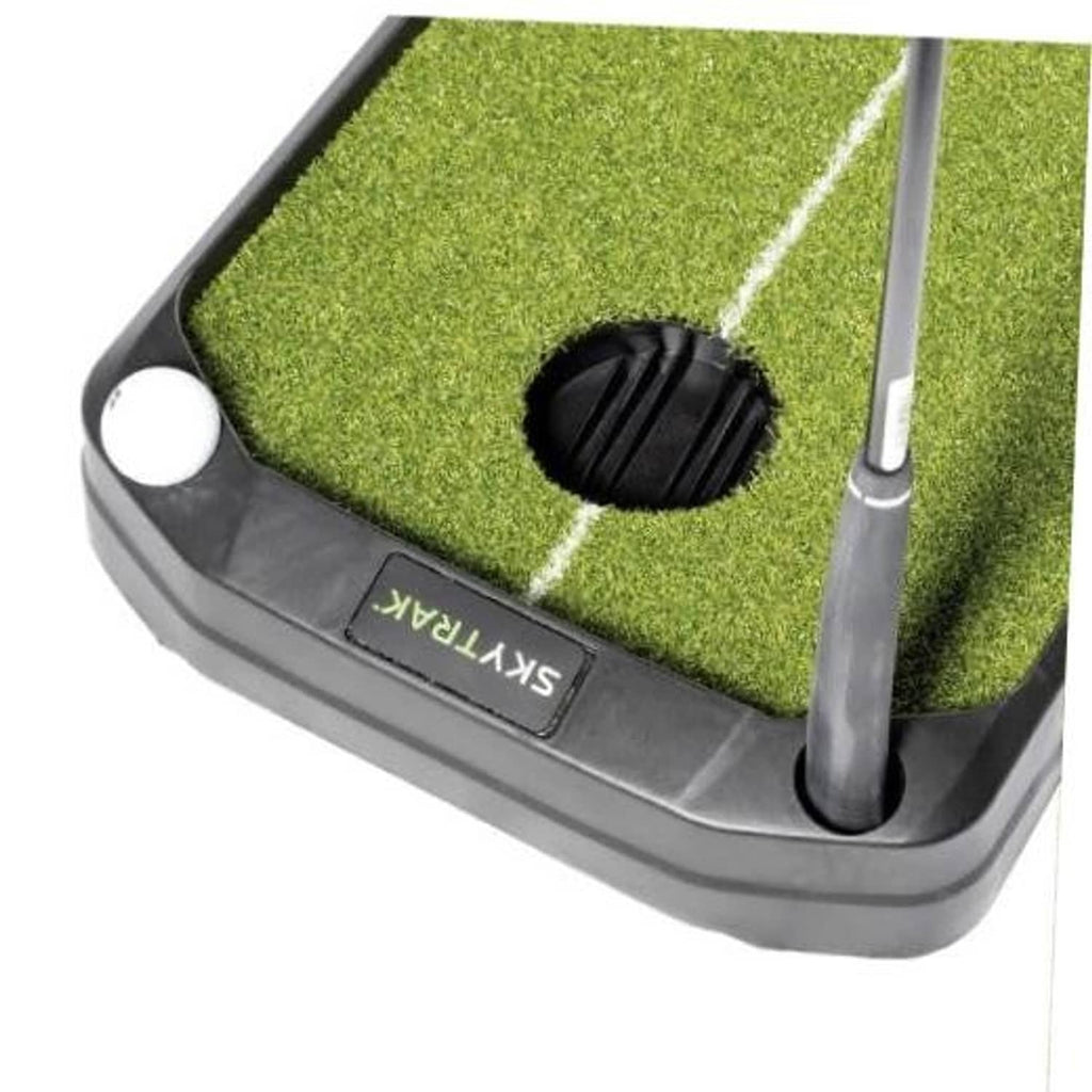 Putting mat base with ball return opening, cup target hole and alignment line