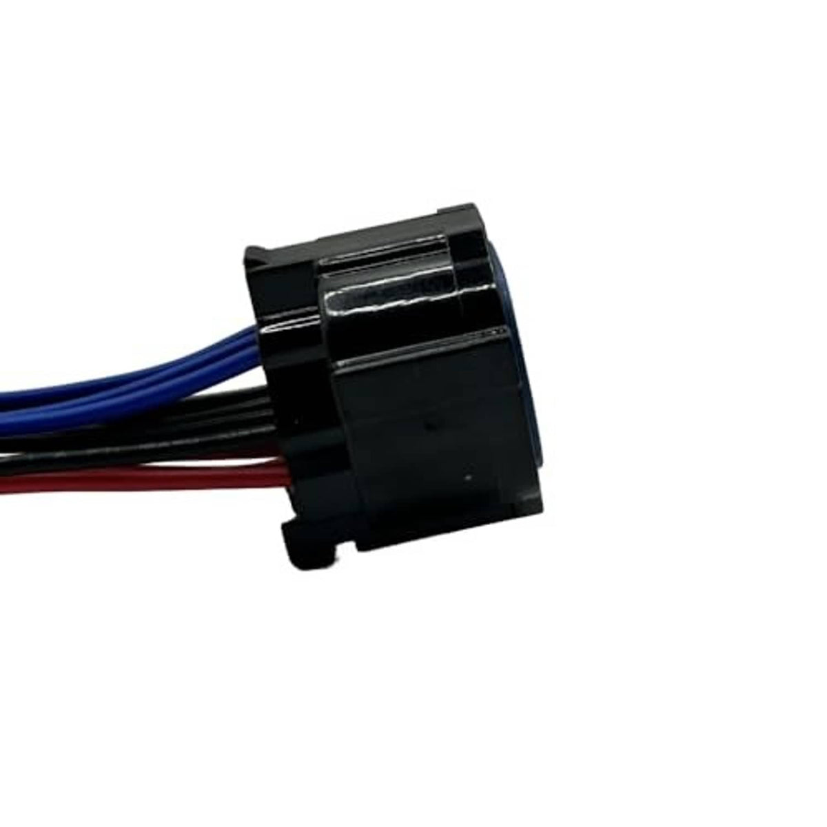 Headlight connector pigtail close-up with black housing and blue/red/black wire leads