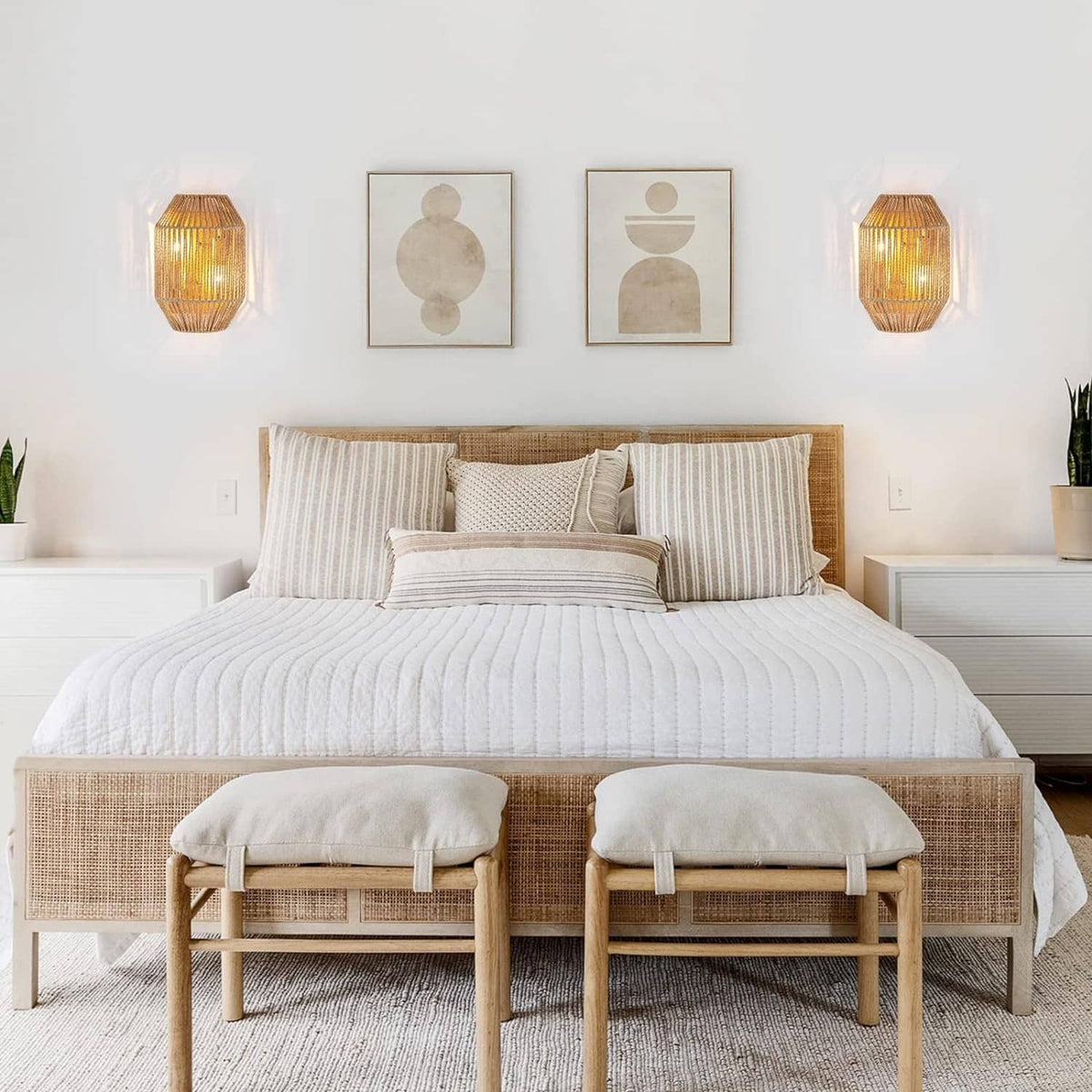 Set of 2 woven rattan wall sconces with glowing light through the lattice shades