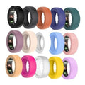 Set of 15 silicone ring covers in assorted colors, including black, orange, blue, and teal.