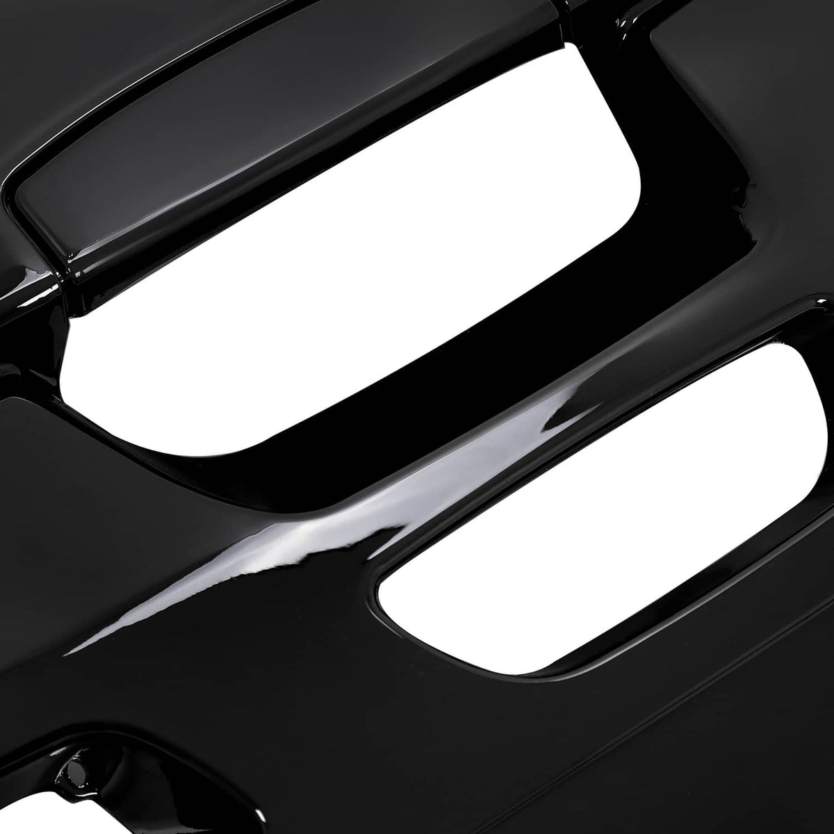 ABS outboard cowling airdam cap close-up, black with oval vent slots and glossy edges