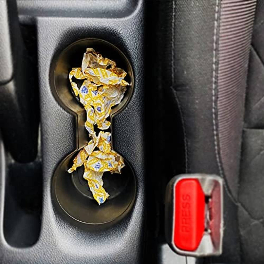 Wrapped cough drops in a car cup holder