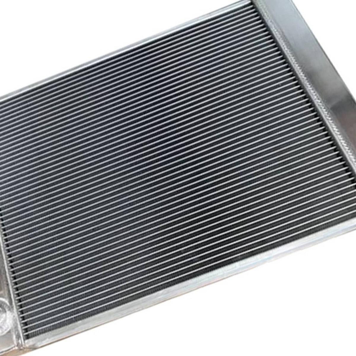 Close-up of aluminum radiator fin core with silver side tank edges