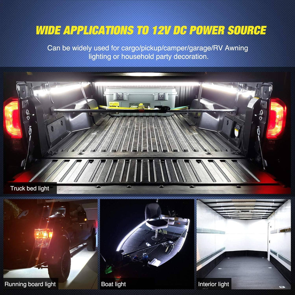 Three LED light strips installed across a truck bed, illuminating the length.