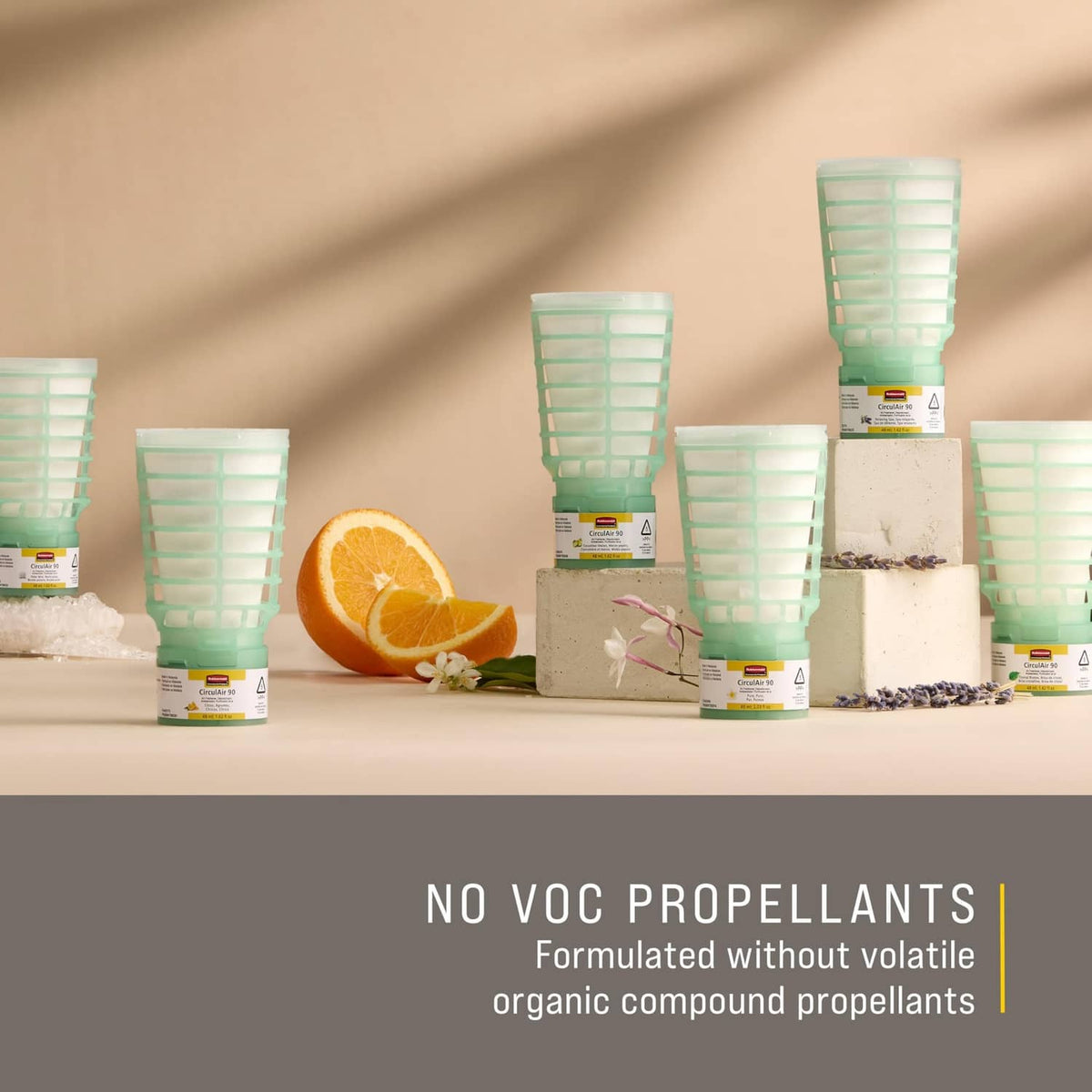 Multiple green translucent air freshener refill cups with white labels