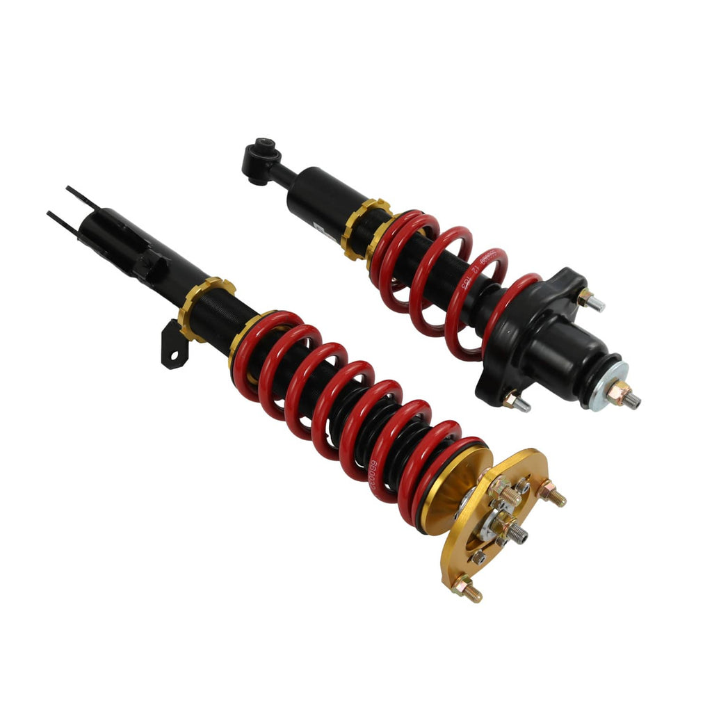Four coilover struts angled view with red springs, black dampers, and gold adjuster collars