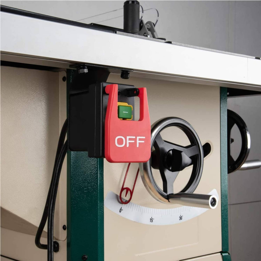 Magnetic paddle switch mounted on equipment with red OFF paddle and green indicator