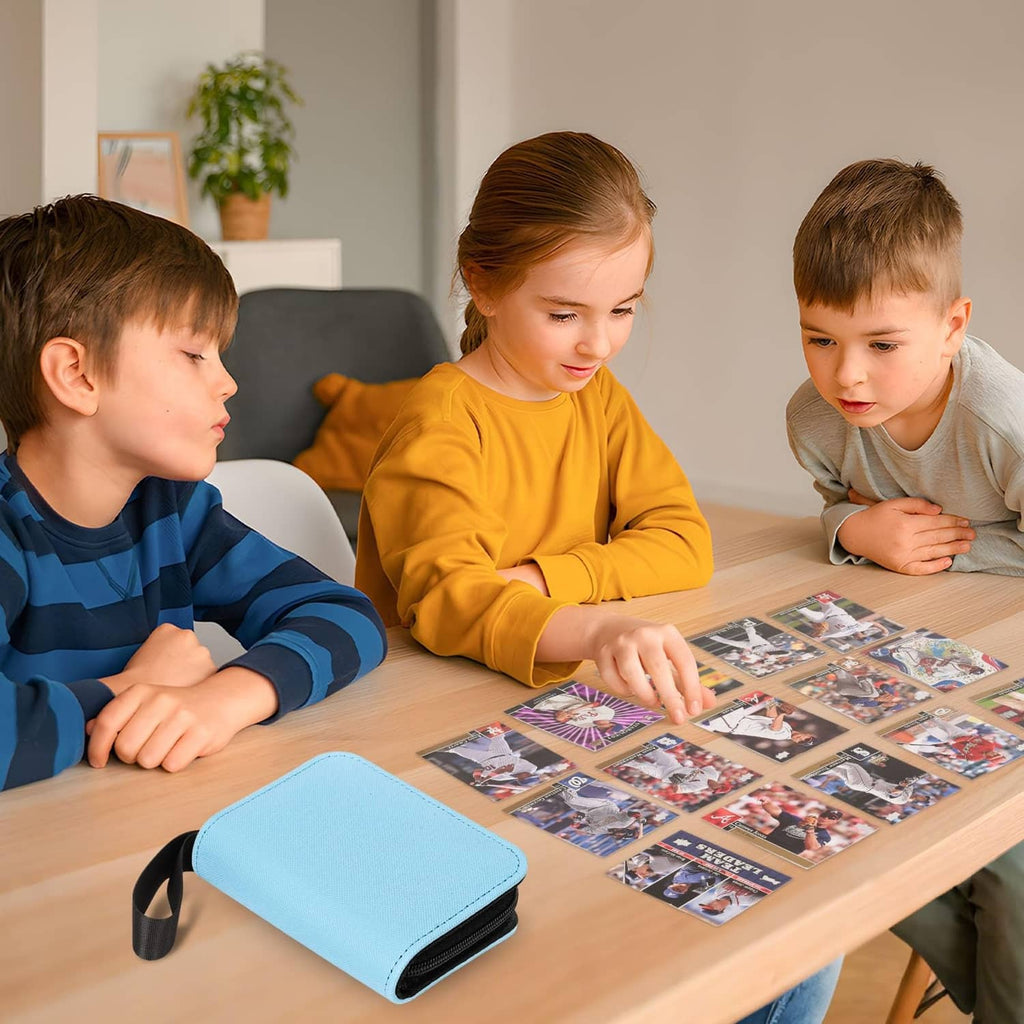 Light blue mini trading card binder on a table beside trading cards