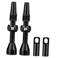 Black Presta tubeless valve stem set with caps; two stems shown with end covers