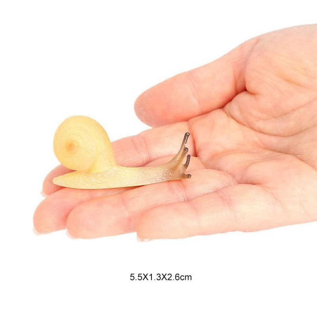 Realistic mini snail figurine held in a hand, pale yellow shell and light beige body.