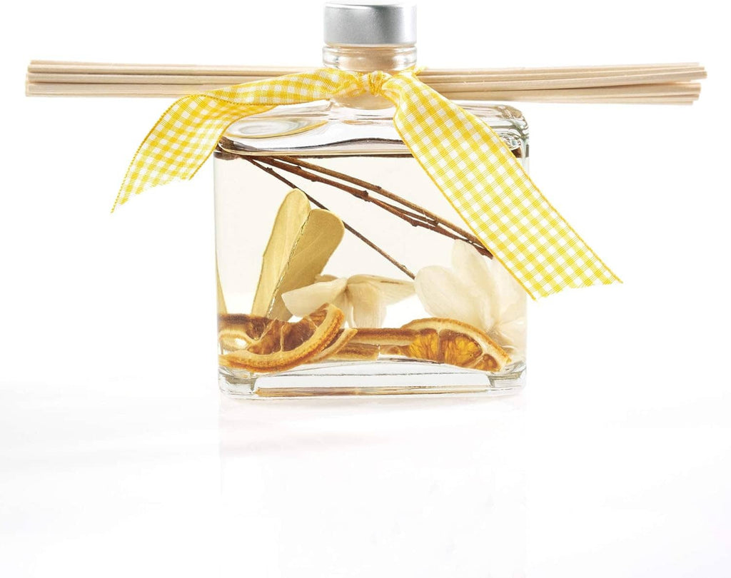 Clear reed diffuser bottle with tan reeds, citrus peel slices, and yellow gingham ribbon