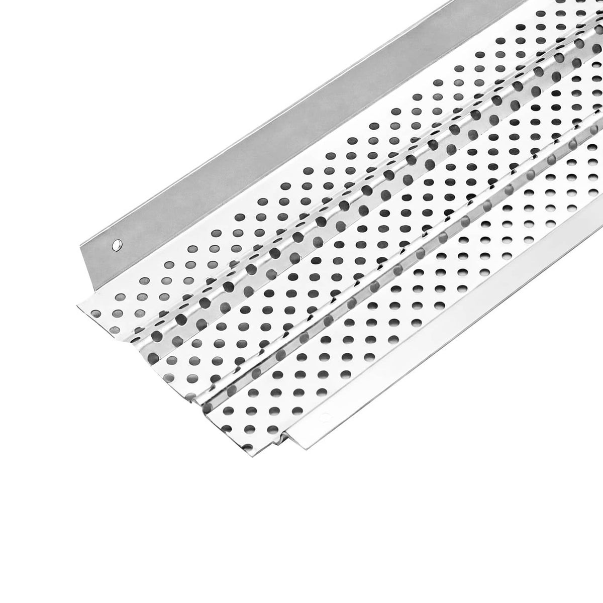 Close-up of perforated aluminum gutter cover panels with raised lip and slots