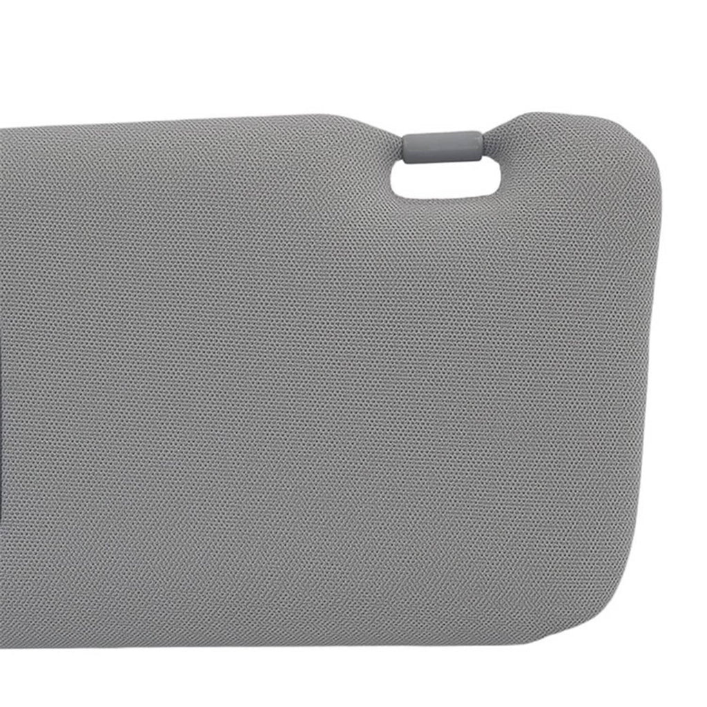 Gray sun visor end cap with pull tab on textured fabric surface