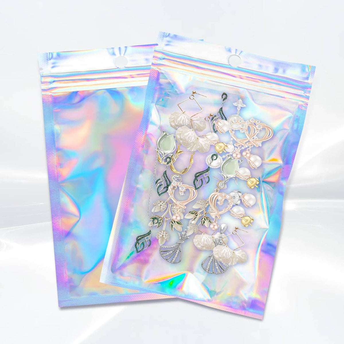 Holographic resealable foil pouch bags with jewelry contents and rainbow hologram shine