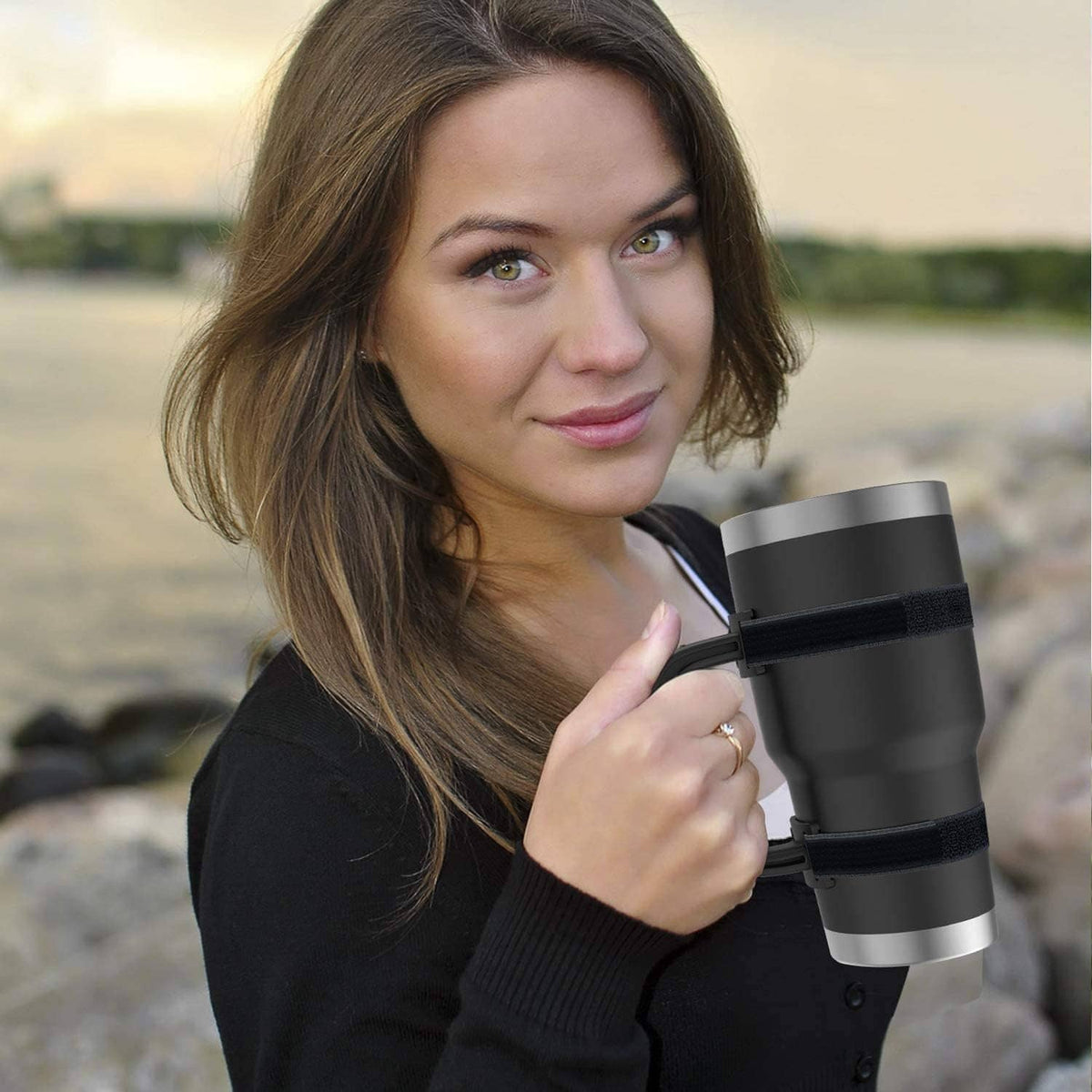 Black anti-slip tumbler handle with textured strap held on a travel cup