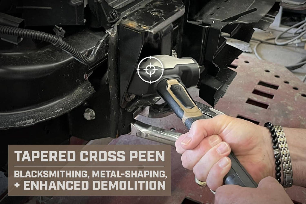 Blacksmith hammer with tapered cross peen, hand holding it beside metal components