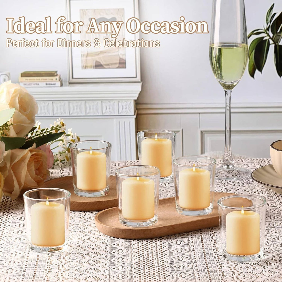 Several clear glass votive holders with lit candles arranged on a wooden base