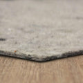 Light gray felt rug pad, textured top edge for cushioning under area rugs