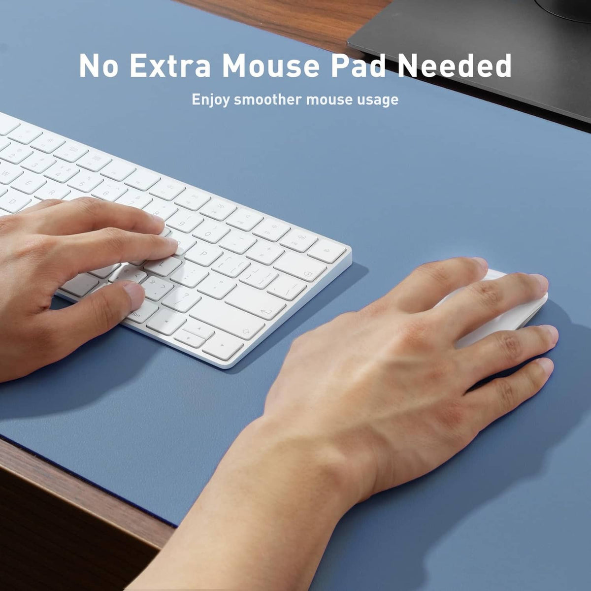 Denim blue desk mat protector for keyboard and mouse, with hands typing