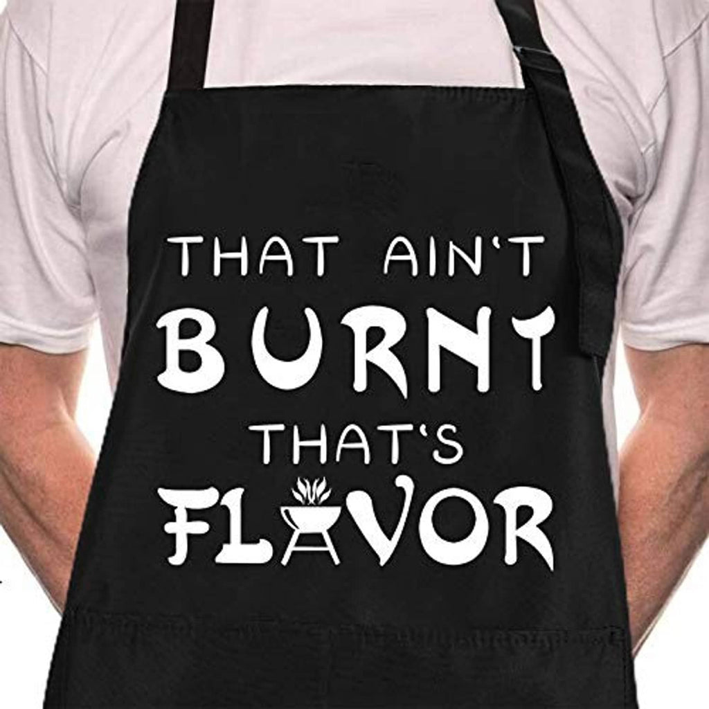 Black BBQ chef apron front with bold “That Ain’t Burnt That’s Flavor” text design.