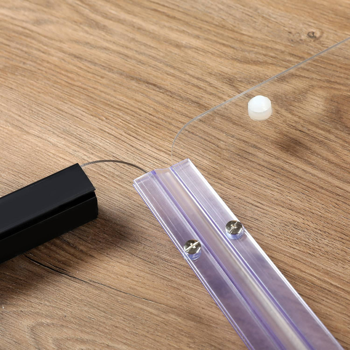 Clear windshield rail piece with screws and small plastic connectors