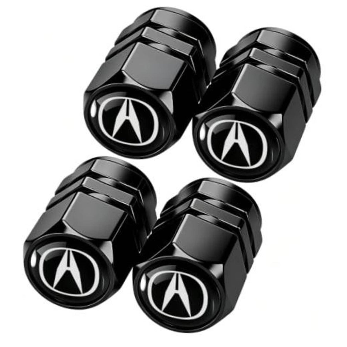 Four black metal tire valve stem caps with Acura logo, faceted hex design