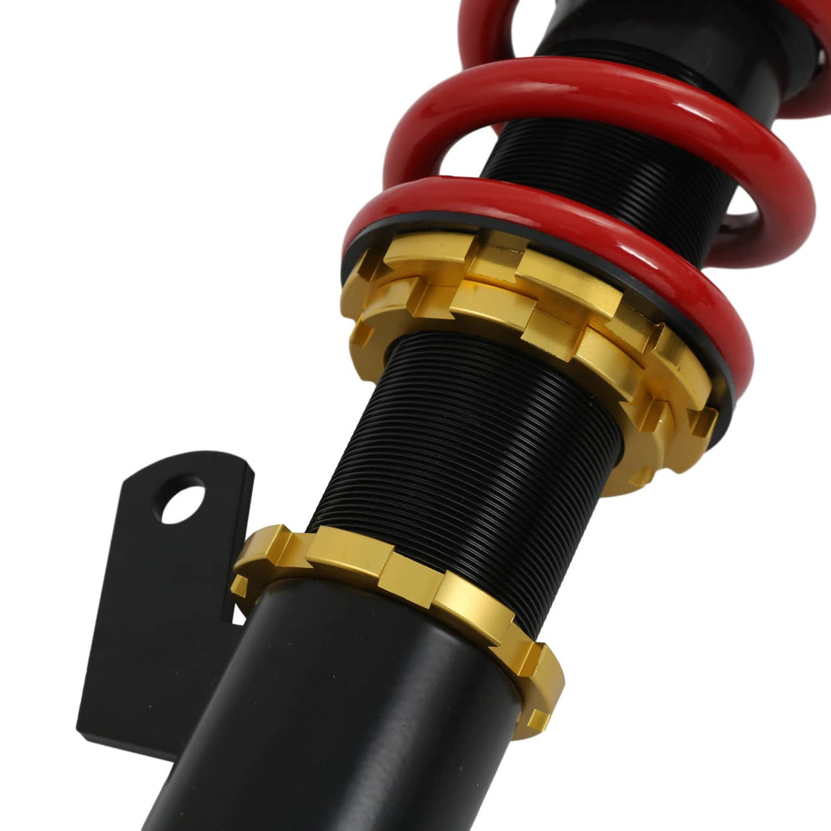 Red coil spring with black threaded adjustment collar on coilover strut