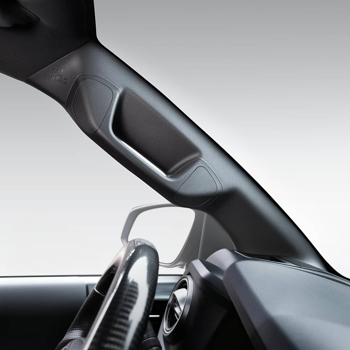 Black driver-side A-pillar grab handle with contoured grip and mounting openings