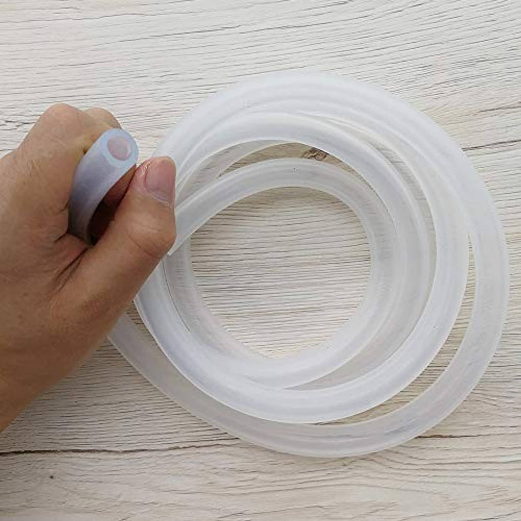Clear silicone tube loop held in hand, flexible 8mm x 12mm size