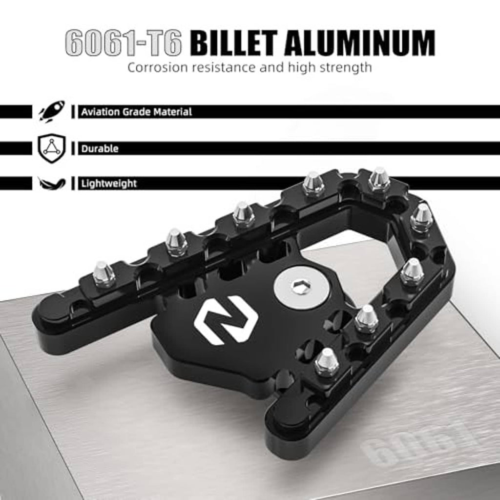 Black billet brake footboard with N emblem and polished hex bolts