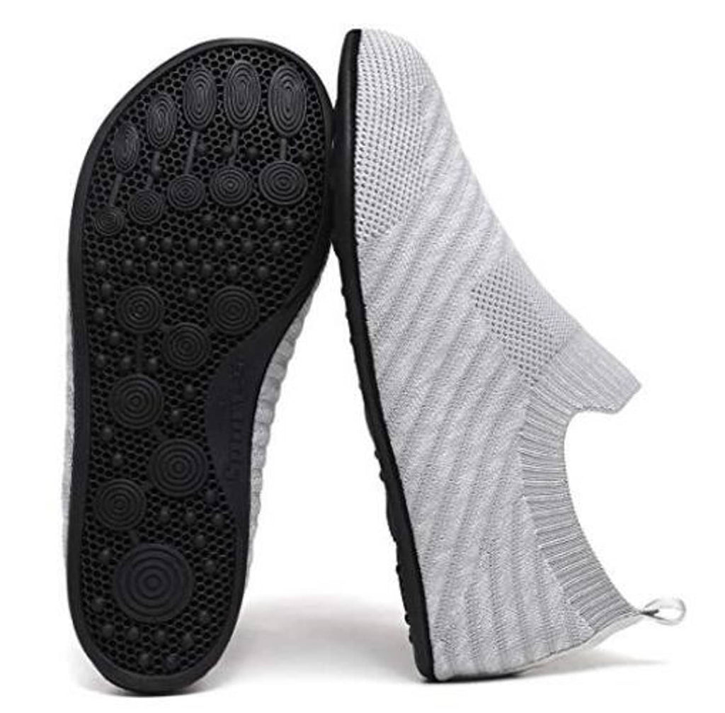 Light gray knit slip-on house shoe with black textured outsole and toe grip pattern