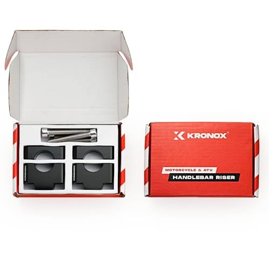 Handlebar riser kit in open box with two black clamps and two silver bolts