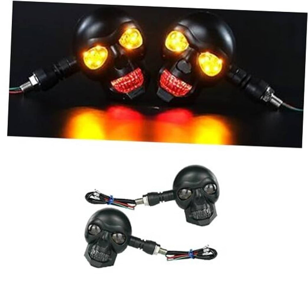 Pair of skull LED motorcycle turn signal lights with glowing red tail and yellow turn lamps