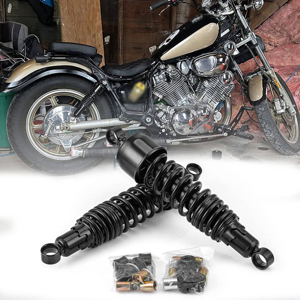 Front motorcycle wheel and chrome engine with black rear shocks shown on white