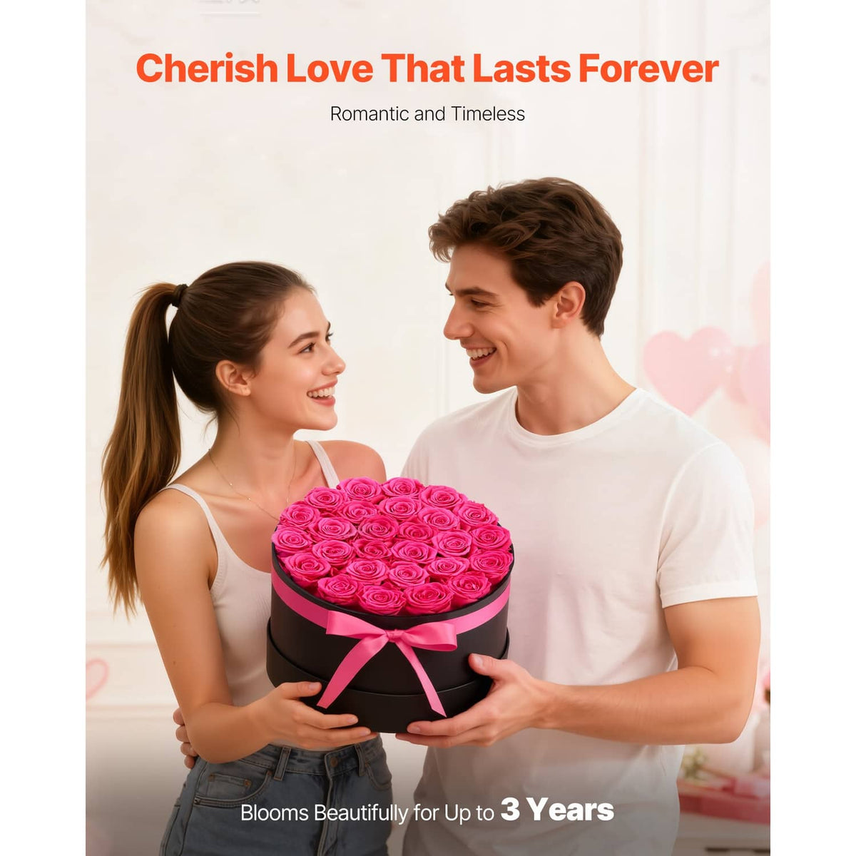 Preserved rose bouquet in black round box with pink ribbon held by two people