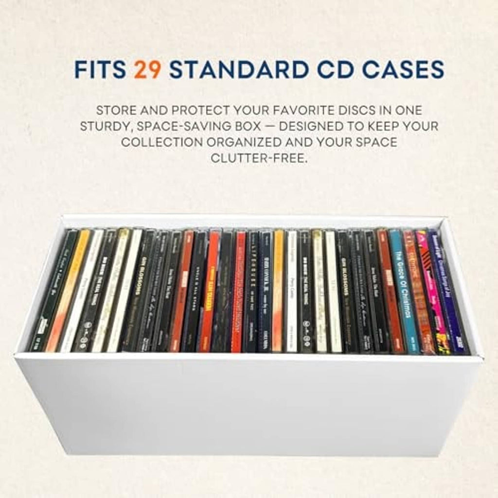 White cardboard CD storage box with lid open, holding many standard CD cases