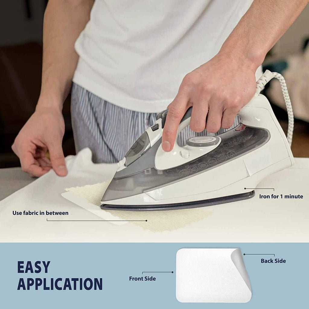 Iron-on patch being pressed onto fabric with a household iron