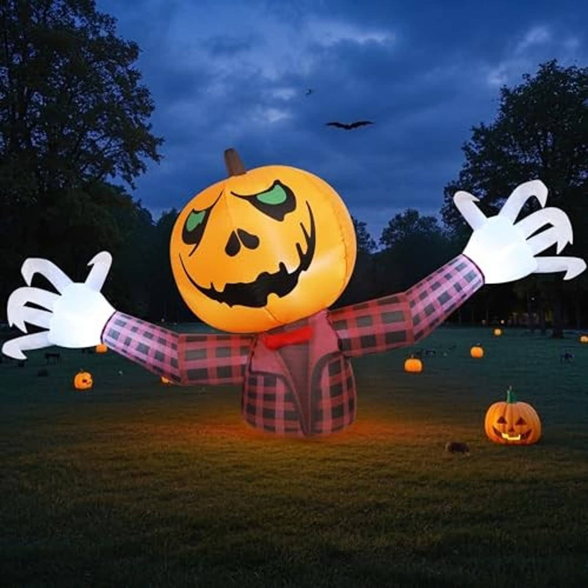 Inflatable orange pumpkin ghost with jack-o-lantern face, red plaid outfit, white pose hands
